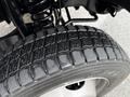 Close-up of a 2016 Ford F-550 Super Duty tire showcasing its tread pattern and texture