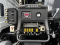 Dashboard controls and gauges of a 2017 International WorkStar 7600 displaying various buttons and a digital readout panel