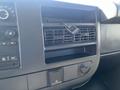 The dashboard of a 2016 GMC Savana featuring air vents and various control buttons