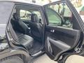 A 2015 Kia Sorento with an open driver's side door revealing a spacious interior featuring black upholstery and two front seats