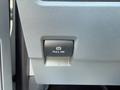 A parking brake lever labeled Pull On inside a 2023 Ford F-550 vehicle