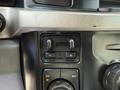 Controls and knobs for a 2023 Ford F-550's drivetrain settings and temperature adjustment
