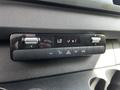 Control panel of a 2020 Mercedes-Benz Sprinter featuring buttons for climate control adjustments and air conditioning settings