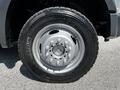 Close-up of a silver wheel and tire from a 2008 Ford F-550 showcasing a sturdy design and Michelin branding