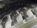 Close-up of a large tire from a 2011 International 4300 showcasing deep treads and textured rubber surface
