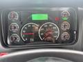 The dashboard of a 2016 Freightliner 108SD displaying various gauges including speedometer RPM fuel temperature and oil pressure indicators