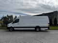 A white 2016 Mercedes-Benz Sprinter van parked with a high roof and large cargo area