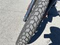 A close-up of a 2022 Royal Enfield Himalayan motorcycle tire showing the tread pattern and rubber texture