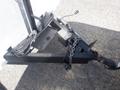 A black trailer hitch with a chain and cables attached showing the connection point for a 2004 Royal 18 Foot Office Trailer