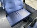 A blue fabric seat from a 2017 Chevrolet Express with a flat cushion and backrest visible