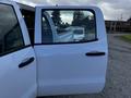 A white 2017 GMC Sierra 1500 truck door with a visible handle and window