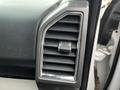 Close-up of a dashboard air vent in a 2016 Ford F-150 featuring a chrome frame and adjustable slats