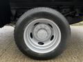 A silver wheel with a black tire marked Hercules 225/70R19.5 mounted on a 2017 Ford F-550