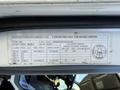 A vehicle identification label detailing specifications for a 2014 Hino 195 including weight ratings and tire information