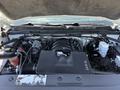 Close-up of the engine compartment of a 2016 GMC Sierra 1500 showcasing the V8 engine and surrounding components