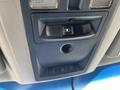 Interior overhead console of a 2011 RAM 1500 featuring light controls a power door lock switch and additional rocker switches for various features