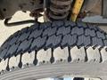 Close-up of a tire from a 2015 Ford F-450 SD showing tread pattern and details of the rubber surface