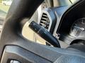 Close-up of the steering wheel and control stalk of a 2019 Ford F-550 showcasing the turn signal and wiper control features