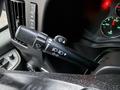 The image shows the control stalk of a 2016 GMC Savana featuring wiper and turn signal controls along with various indicator lights on the dashboard