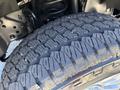 Close-up of a treaded tire of a 2020 Ford F-350 SD showcasing its deep grooves and rugged design for enhanced traction and durability
