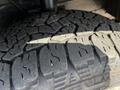 Close-up of a textured tire tread from a 2022 Ford Transit showcasing deep grooves and wear patterns