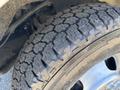 A close-up of a tire from a 2020 Chevrolet Express showing detailed tread pattern and alloy wheel