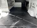 Interior view of a 2020 Mercedes-Benz Sprinter showing a clean, empty cargo space with a rubberized floor and metal shelving along one side