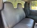 Two black leather seats with a contoured design in the cabin of a 2018 International DuraStar