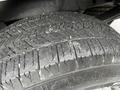 Close-up of a tire from a 2017 Ford F-250 showing tread patterns and texture
