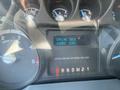 Dashboard of a 2016 Ford F-350 SD showing engine idle message and hours readout with various gauges in the background