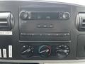 Dashboard of a 2007 Ford F-550 featuring a radio display and control knobs for audio and climate settings