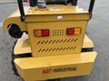 A yellow 2024 AGT Industrial KRW23 Mini Loader with rear lights and a visible brand name on the back