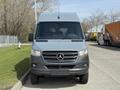 A 2019 Mercedes-Benz Sprinter van in gray facing forward with a prominent front grille and the Mercedes-Benz logo in the center