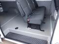 Interior of a 2016 Mercedes-Benz Sprinter showing three gray seats arranged in a row with seat belts installed