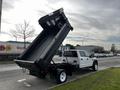 A 2021 Ford F-550 dump truck with a raised bed showcasing capacity for hauling materials