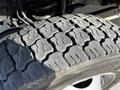 Close-up of a heavily treaded tire from a 2018 Ford F-550 showcasing its rugged design and durable rubber surface