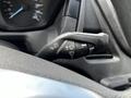 A close-up of the control lever for the windshield wipers and turn signals in a 2018 Ford Transit