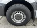 Close-up of the wheel and tire of a 2016 Mercedes-Benz Sprinter featuring a steel rim and Nokian branded tire