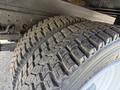 Close-up of a tire from a 2007 GMC W5500 18 Foot Cube Van showing tread patterns and details of the tire surface