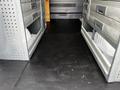 Interior of a 2017 Mercedes-Benz Sprinter with metal drawers and a black floor