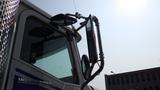 A 2003 International 5600i truck with large side mirrors and a shiny chrome exterior showcasing its distinctive design and branding