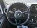 The interior dashboard of a 2019 Mercedes-Benz Sprinter including the steering wheel and control panels