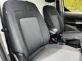 Two black fabric front seats of a 2019 Ford Transit Connect with patterned upholstery and adjustable headrests