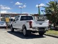 2020 Ford F-350 SD in white with chrome accents and 4x4 badge visible on the tailgate