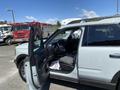 A 2023 Ford Bronco Sport with the driver's side door open showcasing the interior and front seats