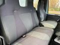 The interior of a 2011 International WorkStar featuring two fabric-covered seats with a gray and black color scheme