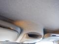 The interior ceiling of a 2016 Mercedes-Benz Sprinter showing textured fabric and built-in storage compartments