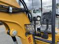 2024 AGT Mini Excavator with hydraulic lines and control levers visible in the foreground