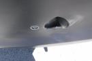 A 2012 Mercedes-Benz Sprinter with a noticeable dent and hole on the side panel