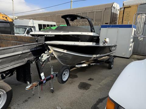 A 2017 ShoreLandr WC16 boat trailer with a Honda BF20 outboard motor attached at the rear of the boat